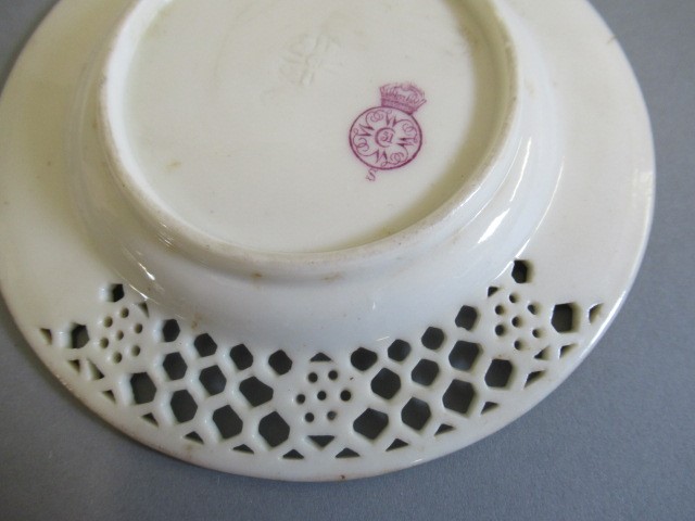 A LATE VICTORIAN ROYAL WORCESTER CHINA RETICULATED CABINET CUP AND SAUCER Image