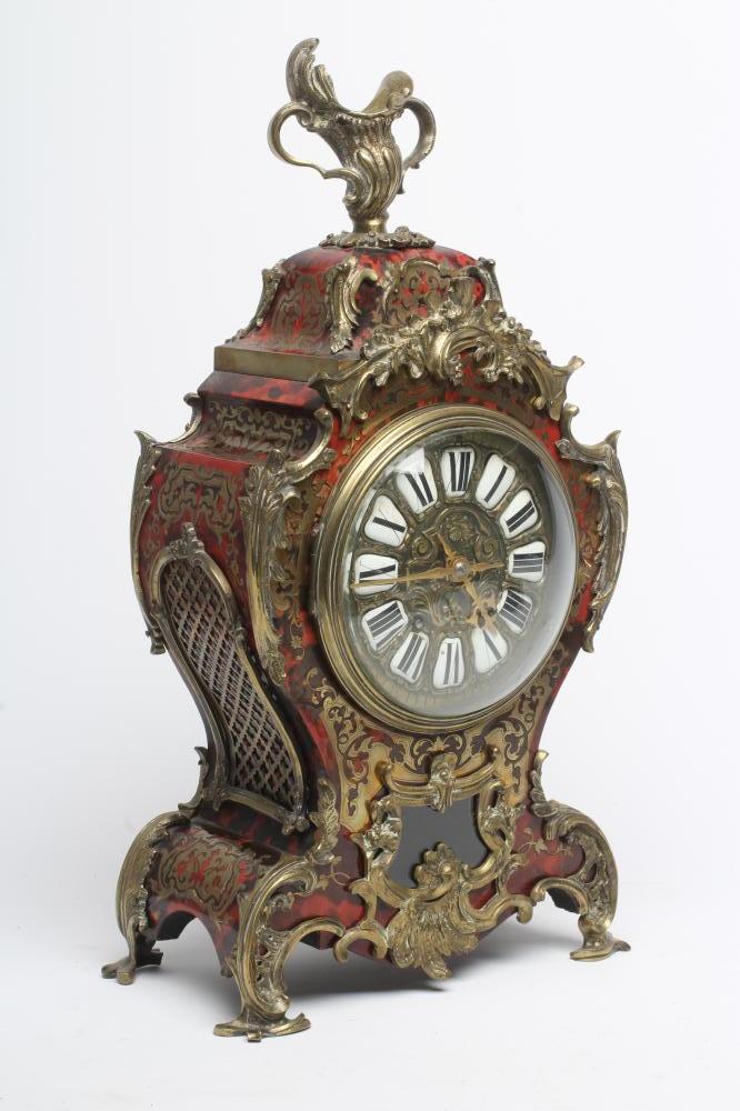A FRENCH RED BOULLE AND GILT METAL TABLE CLOCK Image
