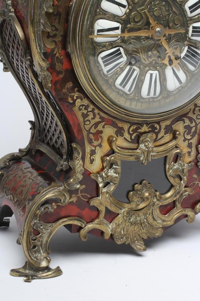 A FRENCH RED BOULLE AND GILT METAL TABLE CLOCK Image