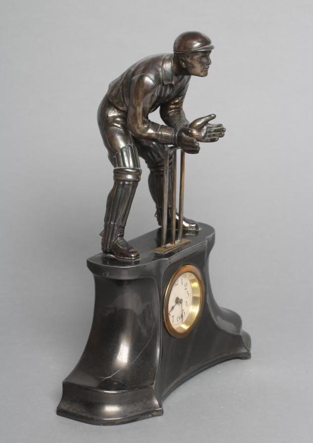 A PEWTER "CRICKET" TIMEPIECE Image