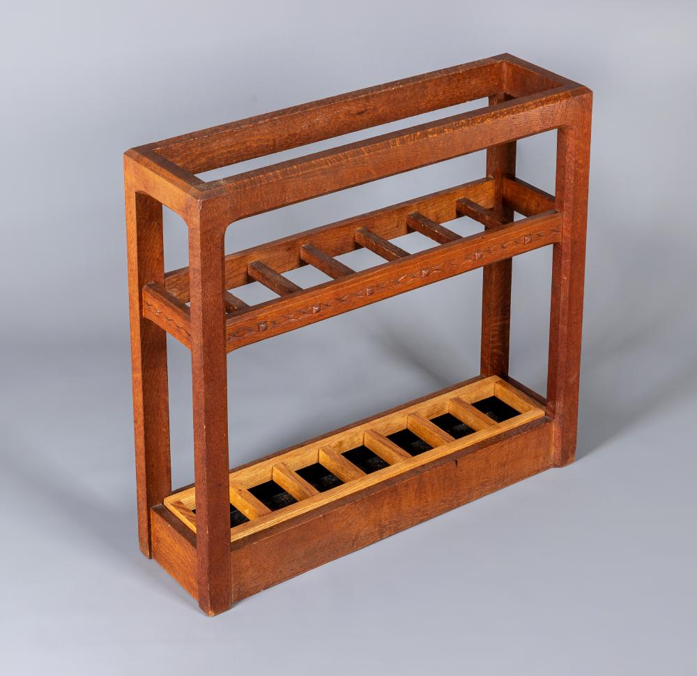 A STANLEY WEBB DAVIES OAK STICKSTAND of oblong form with carved lozenge banding Image