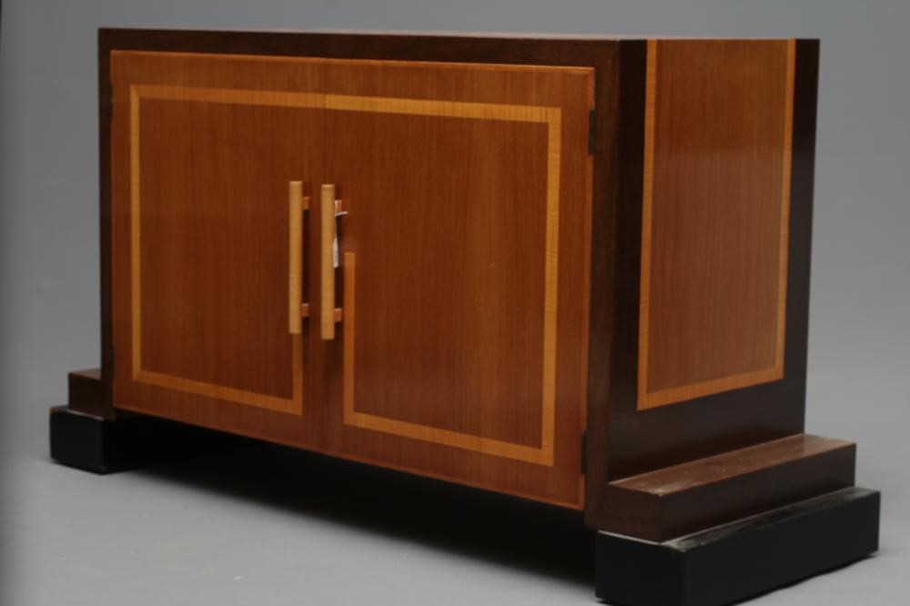 AN ART DECO TWO TONE MAHOGANY SIDEBOARD of oblong form with satinwood banding and ebonised trim Image