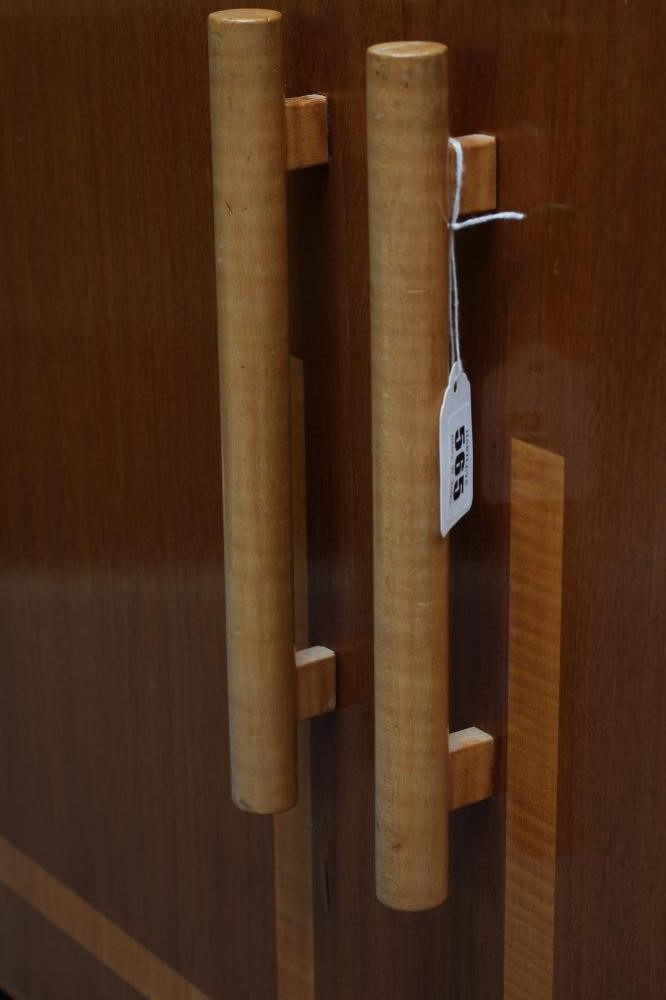 AN ART DECO TWO TONE MAHOGANY SIDEBOARD of oblong form with satinwood banding and ebonised trim Image