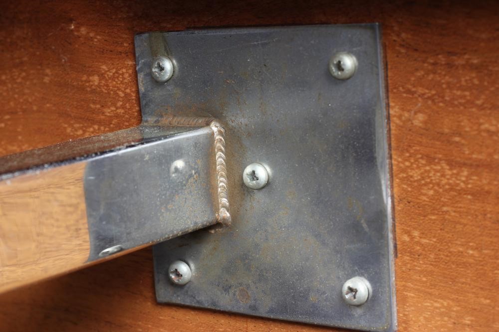 A ROSEWOOD VENEERED AND POLISHED STEEL(?) SIDE TABLE Image