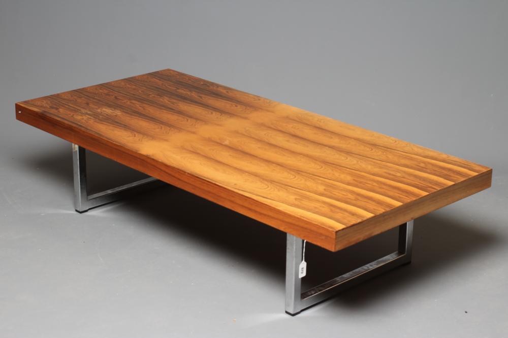A ROSEWOOD VENEERED AND POLISHED STEEL(?) COFFEE TABLE Image