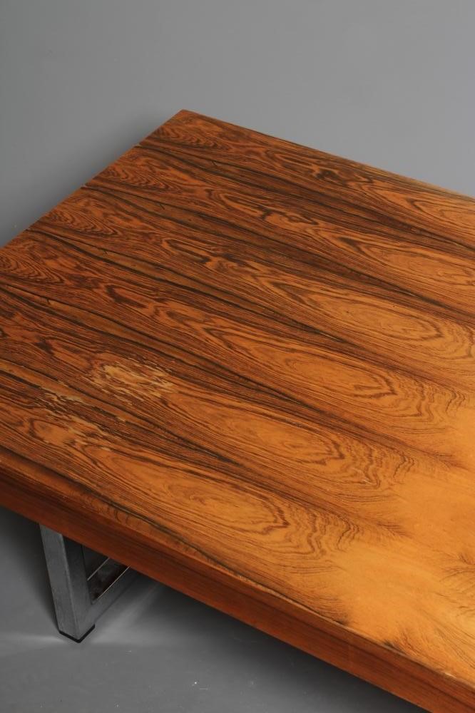 A ROSEWOOD VENEERED AND POLISHED STEEL(?) COFFEE TABLE Image