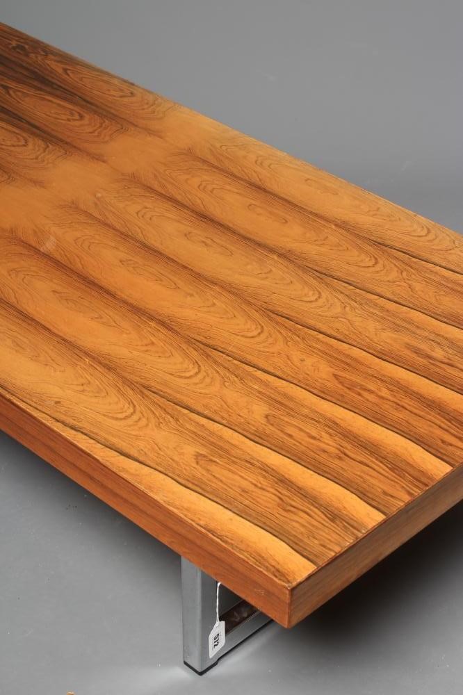 A ROSEWOOD VENEERED AND POLISHED STEEL(?) COFFEE TABLE Image