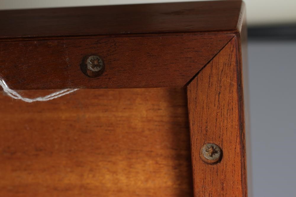 A ROSEWOOD VENEERED AND POLISHED STEEL(?) COFFEE TABLE Image