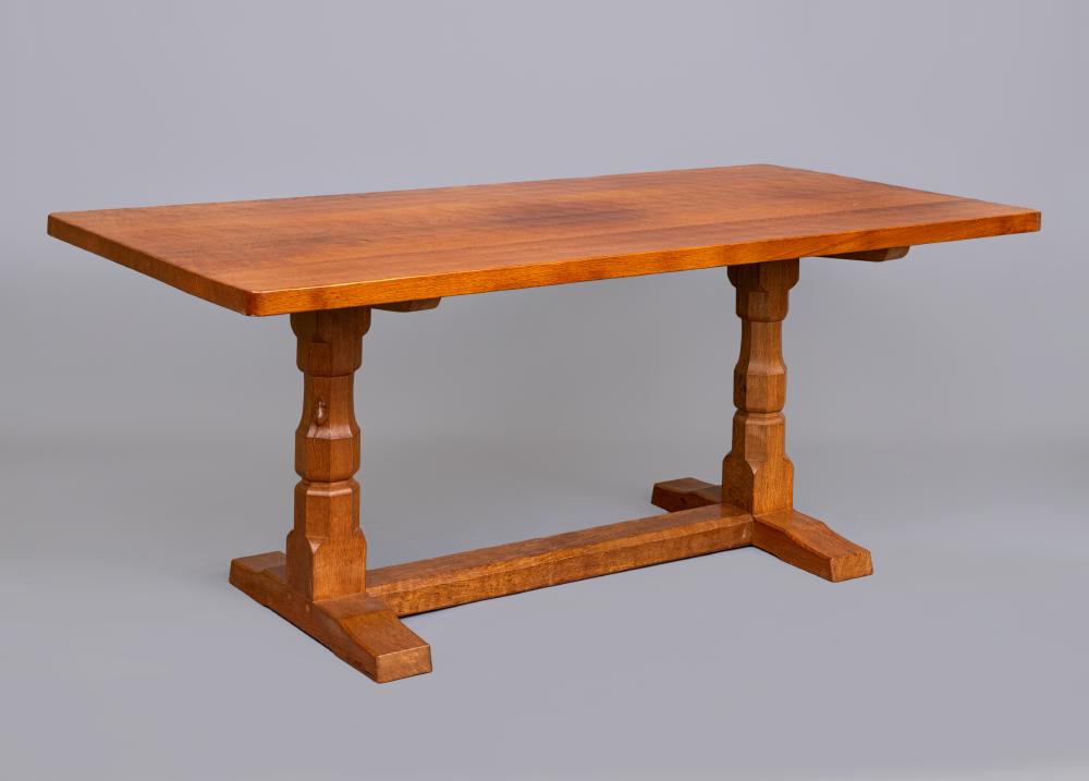 A ROBERT THOMPSON ADZED OAK DINING TABLE Image