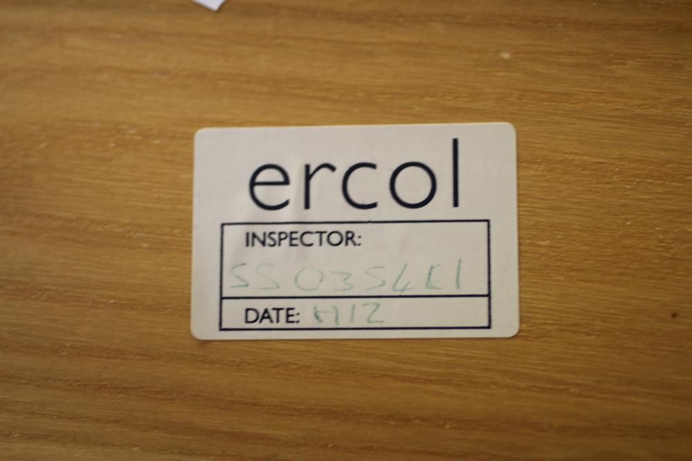 AN ERCOL BEECH AND ELM NEST OF THREE "PEBBLE" TABLES Image