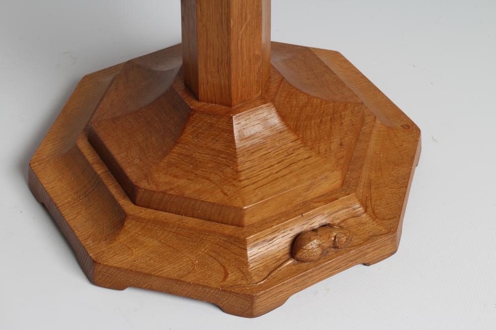 A ROBERT THOMPSON OAK PLANT STAND of octagonal form with collared tapering stem Image