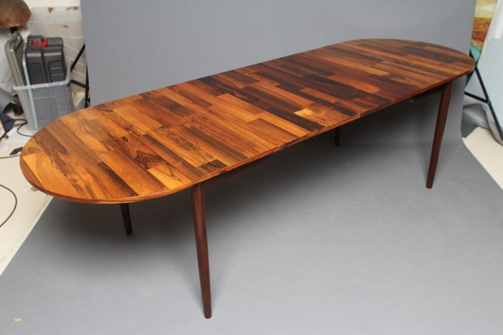 A DANISH DESIGN ROSEWOOD EXTENDING DINING TABLE Image