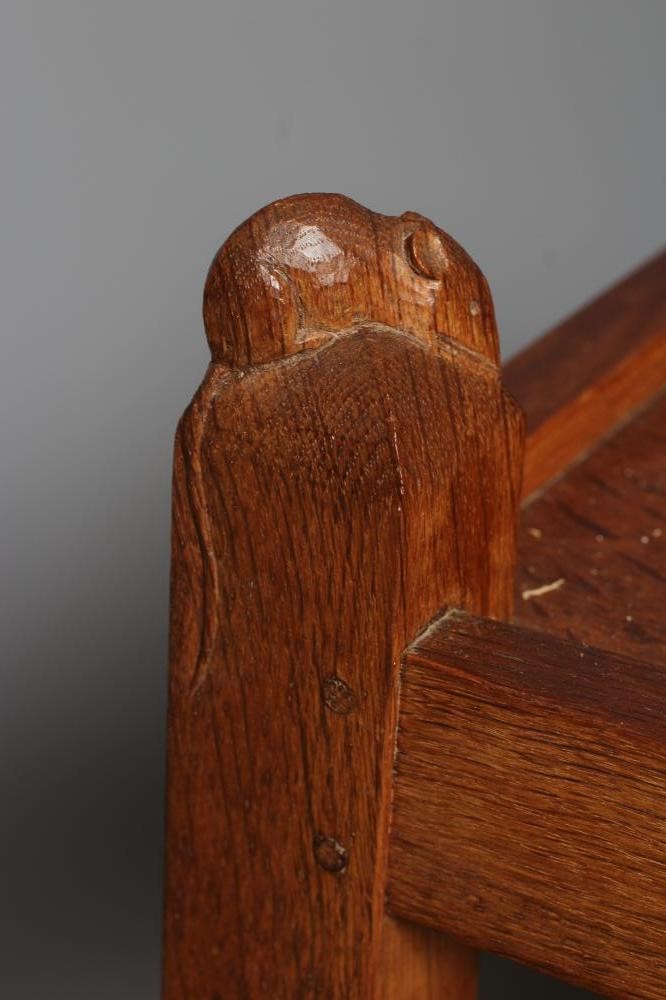 A ROBERT THOMPSON ADZED OAK TEA TROLLEY of oblong two tier form Image