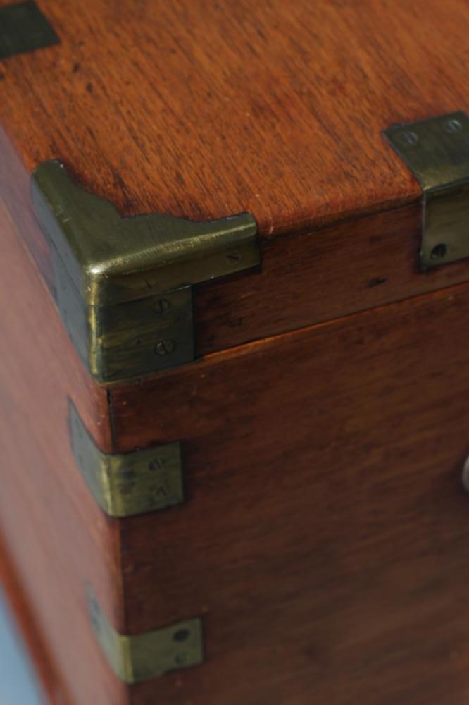 A SMALL MAHOGANY BRASS BOUND TRUNK Image