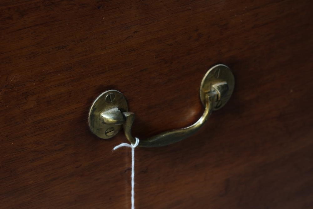 A SMALL MAHOGANY BRASS BOUND TRUNK Image