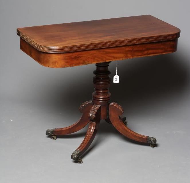 A GEORGE IV MAHOGANY FOLDING TEA TABLE of rounded oblong form with reeded edged top Image
