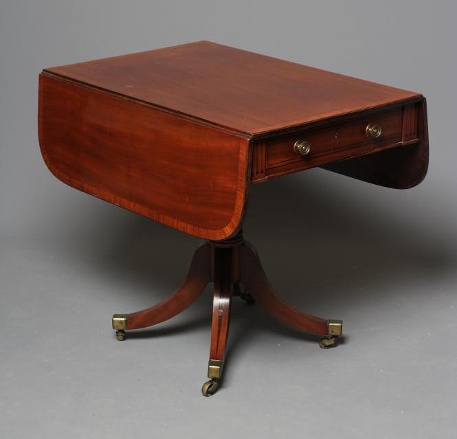 A REGENCY MAHOGANY PEMBROKE TABLE of rounded oblong form with stringing Image