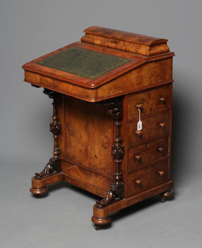 A VICTORIAN WALNUT DAVENPORT Image