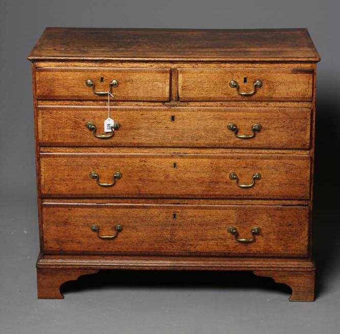 A GEORGIAN OAK AND MAHOGANY BANDED STRAIGHT FRONTED CHEST Image