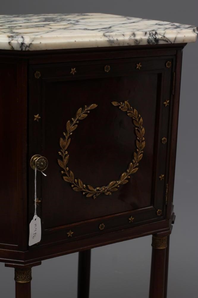 A FRENCH EMPIRE STYLE MAHOGANY BEDSIDE COMMODE of canted oblong form with gilt metal mounts Image