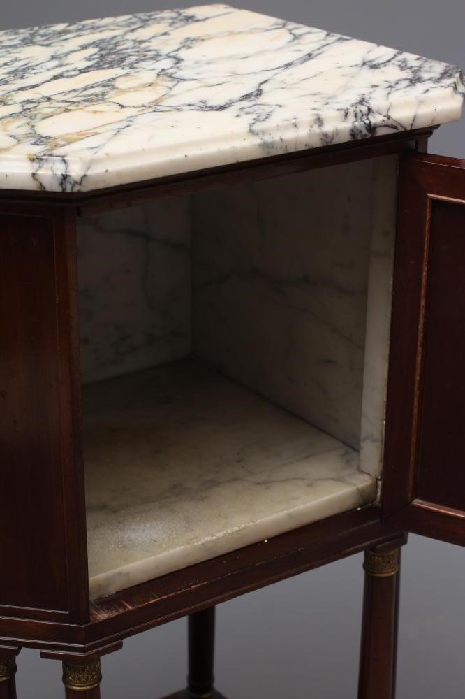 A FRENCH EMPIRE STYLE MAHOGANY BEDSIDE COMMODE of canted oblong form with gilt metal mounts Image