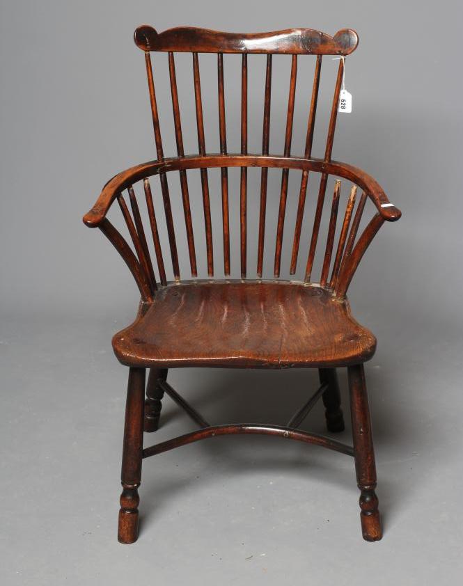A GEORGIAN COMB BACK WINDSOR ARMCHAIR Image