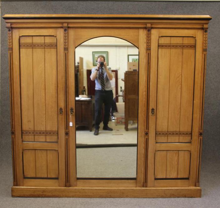 A VICTORIAN AESTHETIC TRIPLE WARDROBE in ash with ebonised trim Image