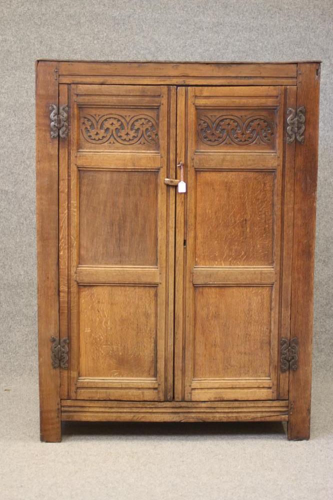 A JOINED OAK PANELLED CLOTHES PRESS Image