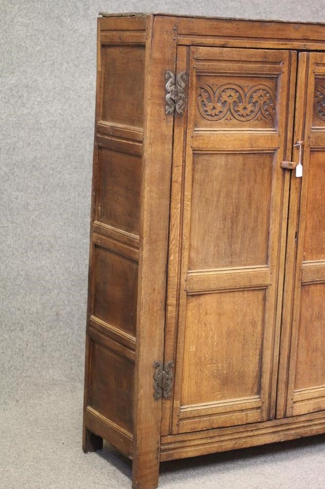 A JOINED OAK PANELLED CLOTHES PRESS Image