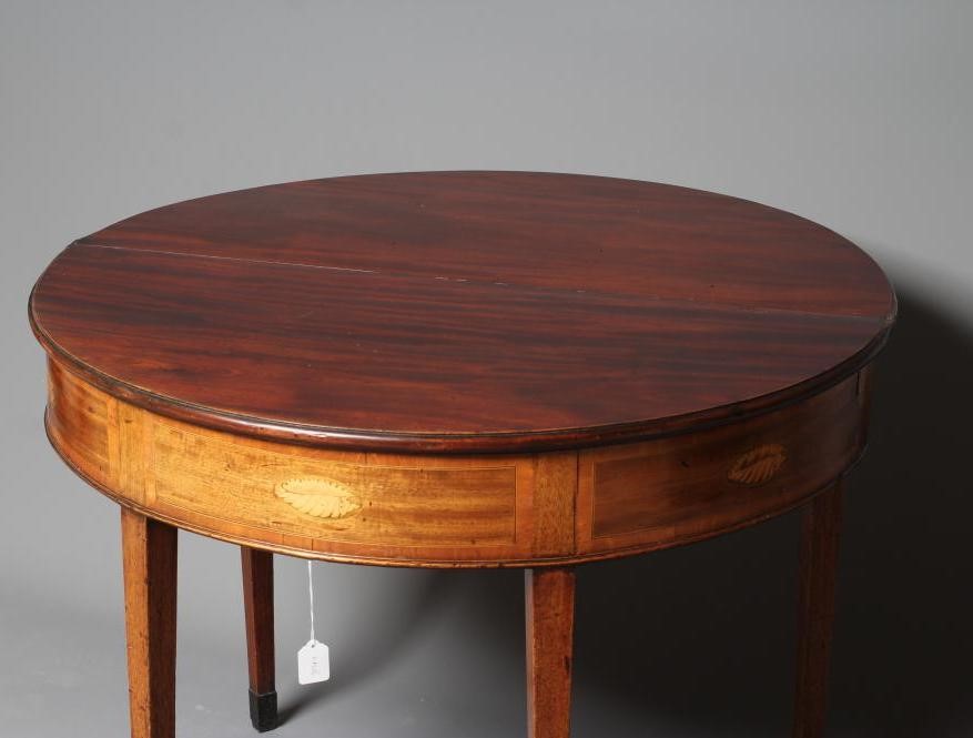 A GEORGIAN MAHOGANY FOLDING TEA TABLE Image