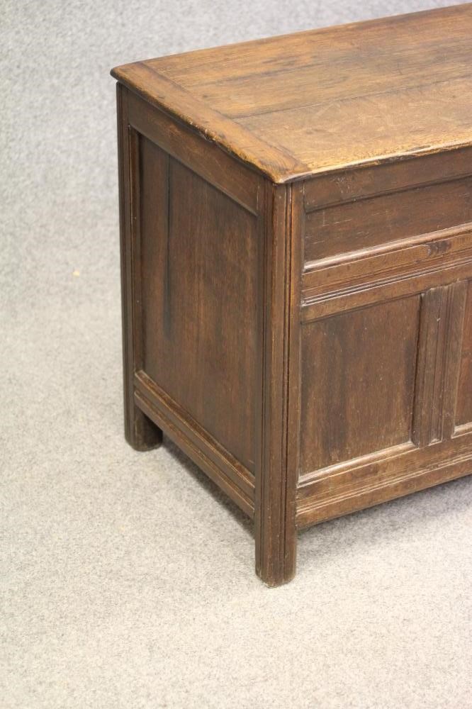 AN OAK PANELLED COFFER Image