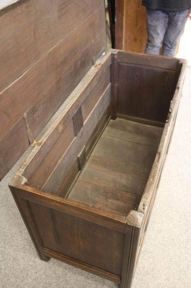 AN OAK PANELLED COFFER Image