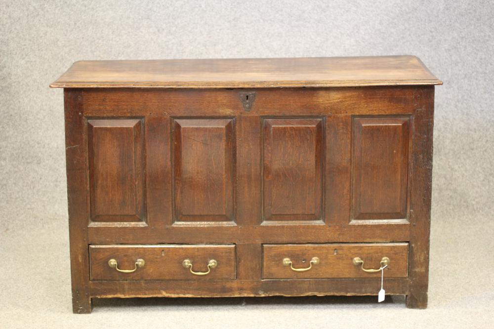 AN OAK PANELLED CHEST Image