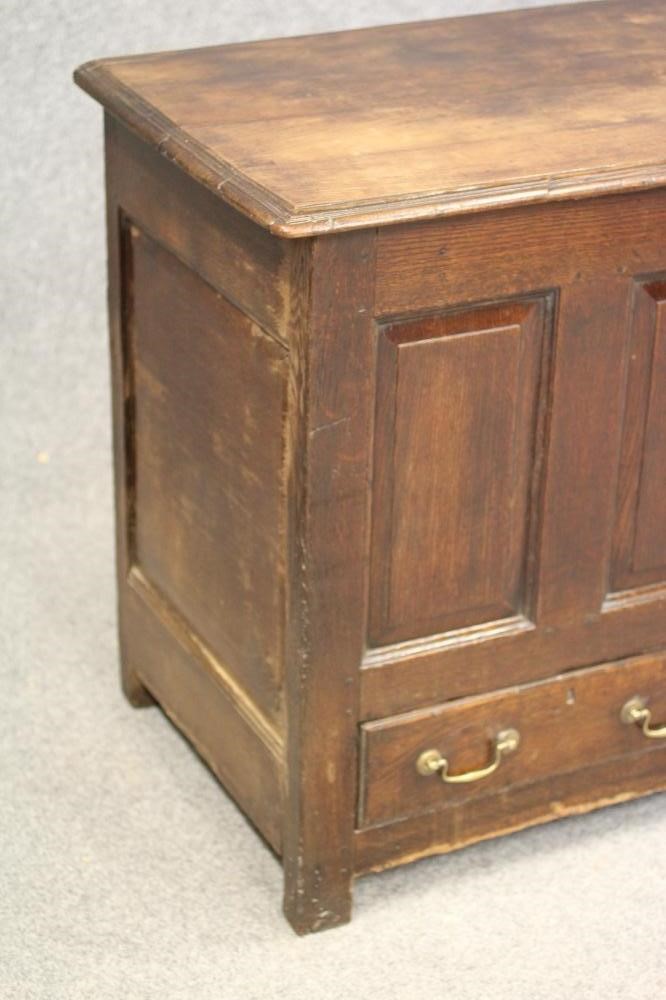 AN OAK PANELLED CHEST Image