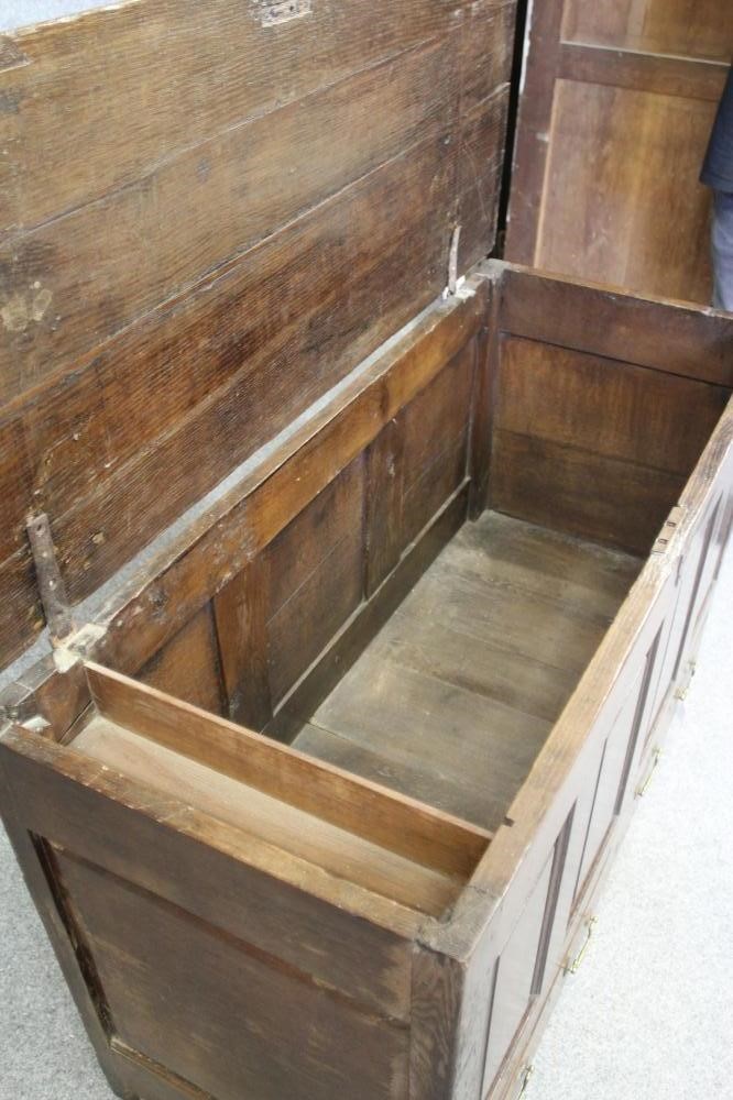 AN OAK PANELLED CHEST Image