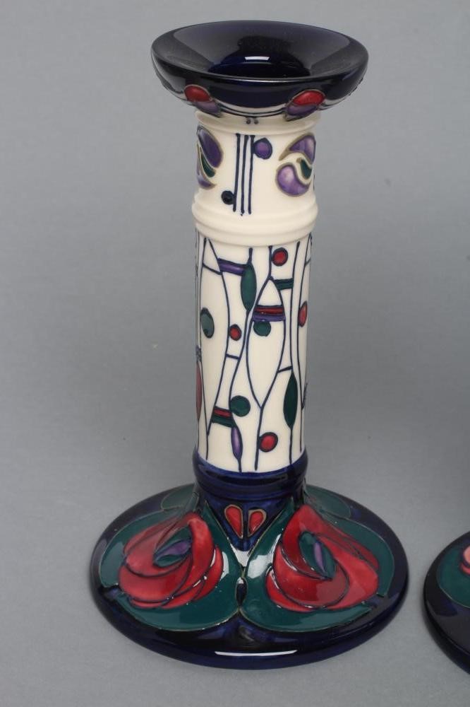 A PAIR OF MOORCROFT POTTERY MACKINTOSH PATTERN CANDLESTICKS Image