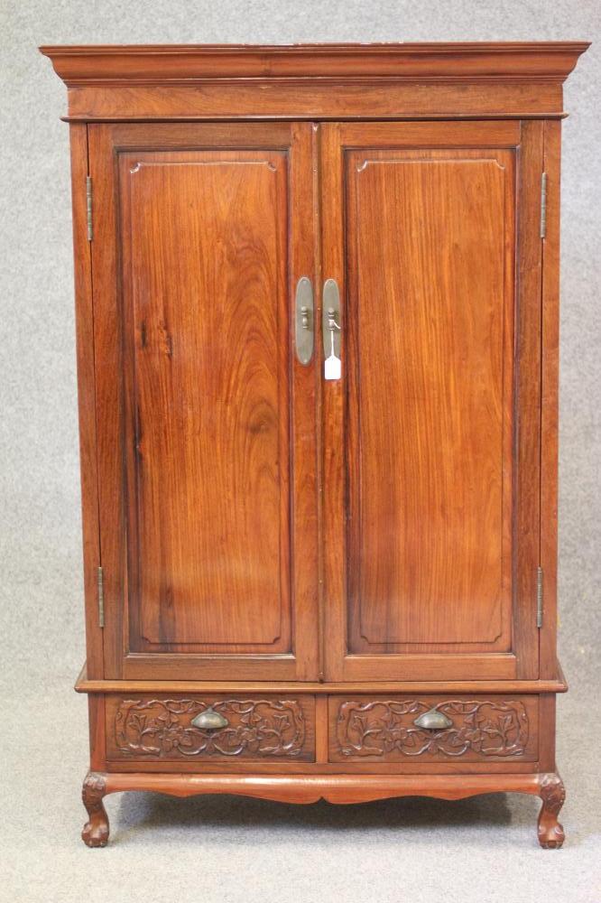 A CHINESE PANELLED CABINET Image