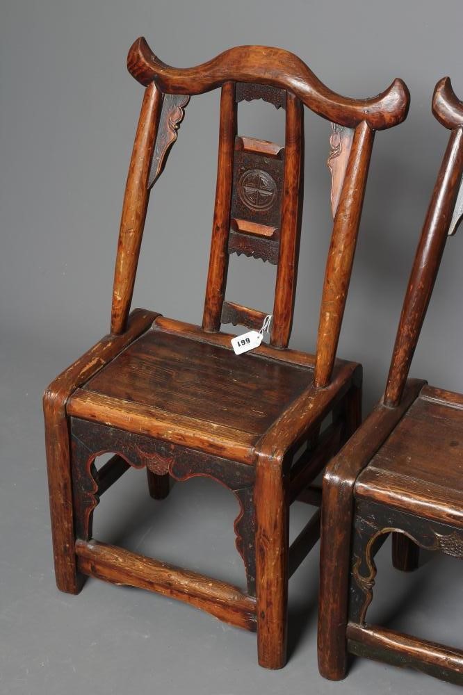 A PAIR OF CHINESE PROVINCIAL STAINED ELM(?) CHILD'S CHAIRS with black painted panels speckled with Image