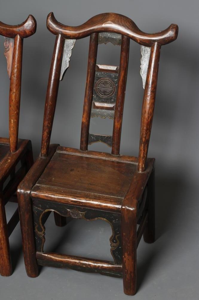 A PAIR OF CHINESE PROVINCIAL STAINED ELM(?) CHILD'S CHAIRS with black painted panels speckled with Image