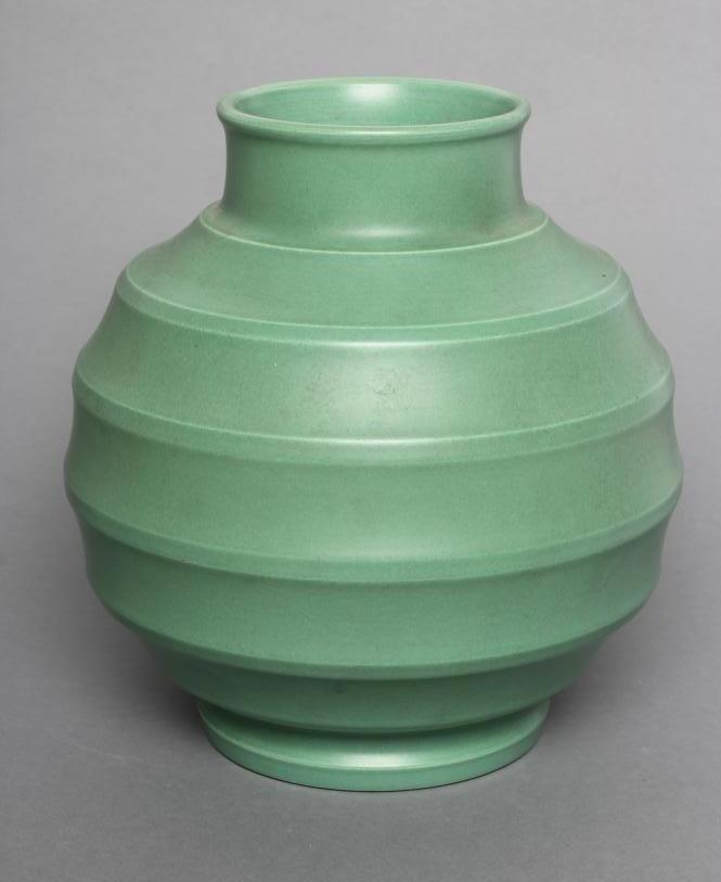 A KEITH MURRAY FOR WEDGWOOD EARTHENWARE VASE of ribbed spherical form in a "Matt Green" glaze Image