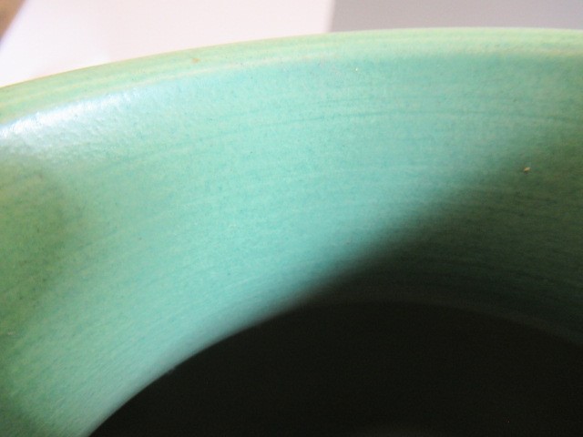 A KEITH MURRAY FOR WEDGWOOD EARTHENWARE VASE of ribbed spherical form in a "Matt Green" glaze Image