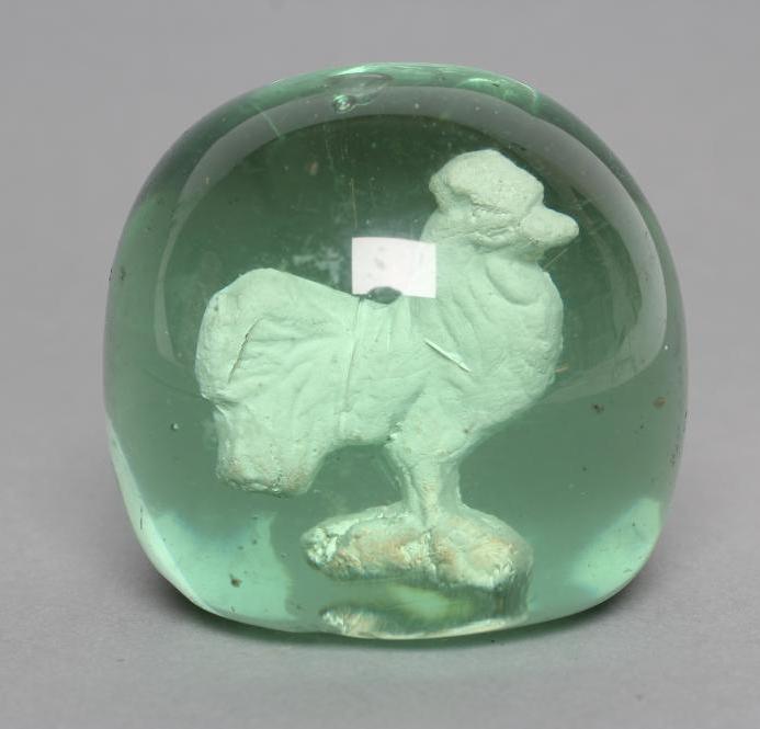 A VICTORIAN GREEN GLASS DUMP of plain domed form enclosing a cockerel sulphide Image