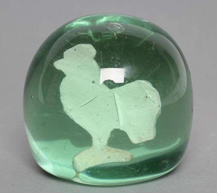 A VICTORIAN GREEN GLASS DUMP of plain domed form enclosing a cockerel sulphide Image