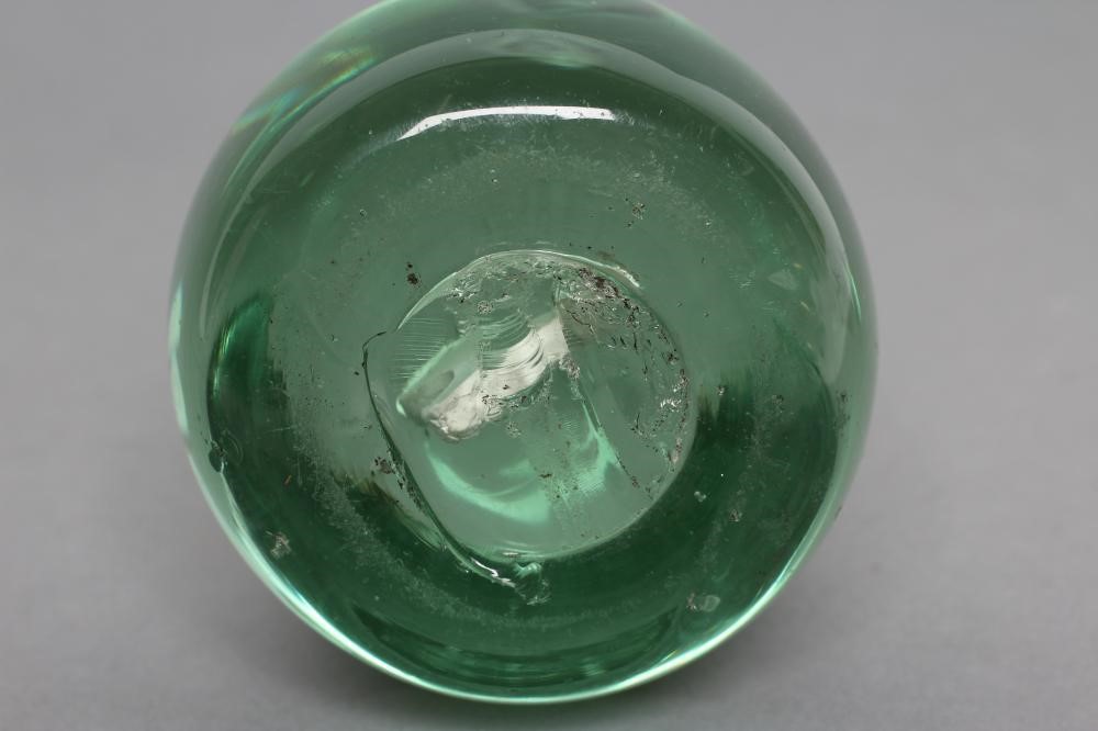 A VICTORIAN GREEN GLASS DUMP of plain domed form enclosing a cockerel sulphide Image