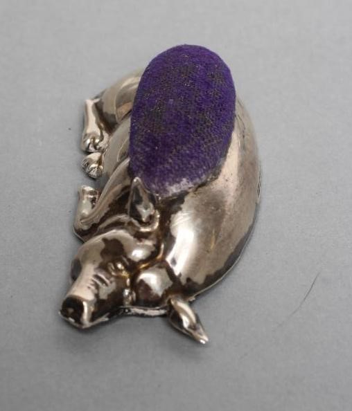 TWO SILVER PIG PIN CUSHIONS Image