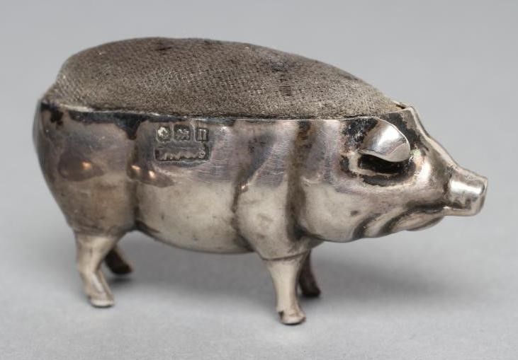 TWO SILVER PIG PIN CUSHIONS Image