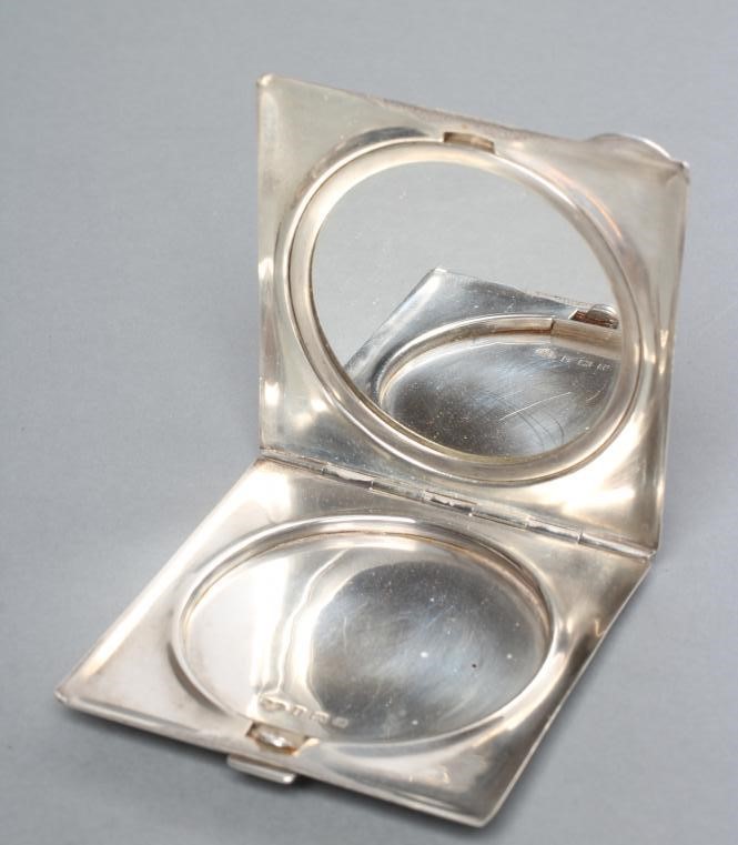 A SILVER COMPACT Image