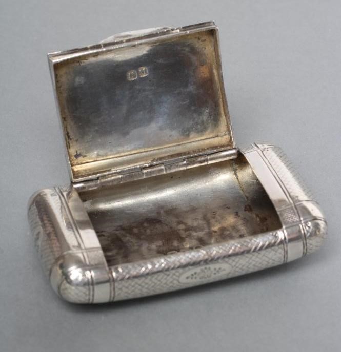 A LATE GEORGE III SILVER SNUFF BOX Image