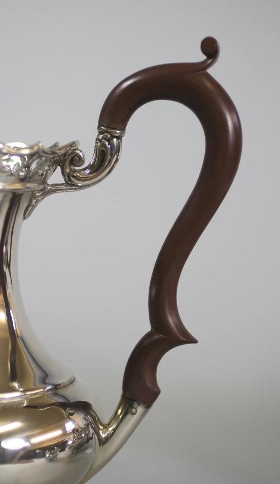 A COMPOSITE SILVER FOUR PIECE TEA AND COFFEE SERVICE Image