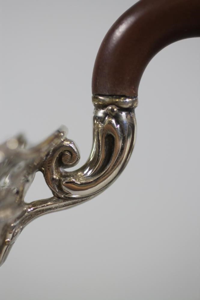 A COMPOSITE SILVER FOUR PIECE TEA AND COFFEE SERVICE Image